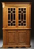 English Carved Pine Corner Cabinet, late 19th c., the stepped canted corner crown over double mullioned glazed doors, flanked by canted reeded pilaste