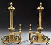 Pair of Louis XV Style Bronze Andirons, early 20th c., with relief ball tops on turned and reeded supports, to floral relief decorated bases, on paw f