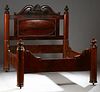 American Rococo Carved Mahogany Cut Down Tester Double Bed, mid 19th c., the arched headboard with a central carved leaf, over an oval panel, flanked 
