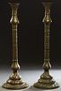Near Pair of Antique East Indian Pierced Brass Columnar Floor Lamps, 20th c., with everted flat tops over a bulbous knop on an intricately pierced rel