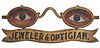 A CLASSIC PAINTED IRON AND ZINC OPTICIAN'S TRADE SIGN