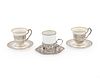A Group of Silver Demitasse Frames and Saucers