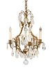 A Louis XV Style Gilt-Metal, Rock Crystal and Glass Four-Light Chandelier
Height 19 x diameter 13 inches.