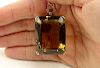 Unusually Large 157 Carat Brown Topaz and 14 Karat Yellow Gold Lady's Pendant.