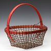 AN UNUSUAL WIRE MESH AND WOOD BASKET IN OLD RED STAIN
