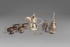 Lot consisting of seven silver objects: four small salt cellars, an Egyptian jug, a wick and a sugar spreader