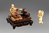 Lot of two small ivory objects: an okimono with kitchen utensils on a square wooden base, and a netsuke, Japan 19th - 20th centuries