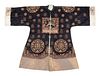 A Midnight Blue Ground Embroidered Silk Lady's Informal Robe
Length 43 in., pit to pit 27 in., 109.2 cm., 68.6 cm.