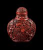 A Carved Red Lacquer Snuff Bottle
Height overall 3 in., 7.6 cm.