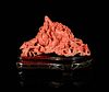 A Red Coral 'Magpie' Carving 
Length 5 3/8 in, 13 1/2 cm. 