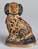 Painted earthenware seated spaniel, 19th c.