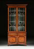 A GEORGE III STYLE CARVED ELM BOOKCASE CABINET, EARLY 20TH CENTURY,