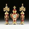 A THREE PIECE CONTINENTAL GILT BRONZE MOUNTED OX BLOOD RED PORCELAIN VASE CLOCK GARNITURE, LATE 19TH/EARLY 20TH CENTURY,