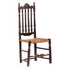 A William and Mary Brown-Painted Bannister Back Cane-Seat Side Chair