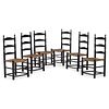 A Set of Six William and Mary Style Black-Painted Rush Seat Ladder-Back Side Chairs