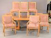 Ten piece Baker blonde dining set with eight chairs, round table and sideboard with 29" large leaf, ht. 29", dia. 46", open: 46" x 100".