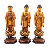 Three Gilt Lacquered Wood Figures of Buddha