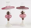 Two Satin Glass Oil Lamps with Milk Glass Bases