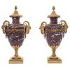 Pair of Jars, Early 20th century, Red marble, gold metal applications.