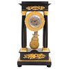Portico Clock, France, Early 20th century, Empire Style, Ebonized wood, Clockwork and pendulum mechanism.
