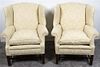 A Pair of George III Style Wingback Armchairs Height 38 inches.