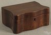 Pennsylvania mahogany serpentine dresser box, 19th c., with a mirrored lid and fitter interior