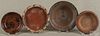 Four assorted Pennsylvania redware articles, to include three dishes and one flowerpot base