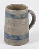 Pennsylvania stoneware mug, 19th c., with cobalt bands, 4 3/8'' h.