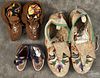 Three pairs of Native American beaded moccasins, mid 20th c., 11'' l., 7'' l., and 5'' l.