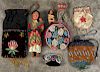 Native American beadwork, to include pouches, a pincushion, etc., together with two Skookum dolls.