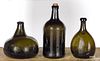 Three blown olive glass bottles, ca. 1800