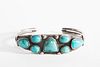 A Navajo Seven Stone Turquoise and Silver Bracelet, ca. 1950