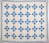 Two blue and white pieced quilts