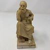 Greek statue, robed philosopher in chair, contemplating