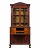 A Regency Carved and Figured Mahogany Secretary Bookcase