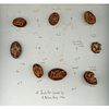 A Group Of Ahnd Carved Peach Pit Buttons