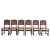 Lote de 6 sillas. Francia. Siglo XX. En talla de madera de roble. Con respaldos semiabiertos y asientos tipo piel color marrón.