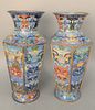 Pair of Large Chinese Cloisonne Vases body having six sides and a foo dog design flared circular rim and foot. 
height 20 1/4 inches...