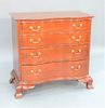 Chippendale Cherry Reverse Serpentine Chest having serpentine below molded edge top over four conforming drawers set on ogee feet wi...