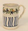 Pearlware Tankard, having raised decoration of wavy blue lines and raised floral border, and raised American Independent 1776, (with...
