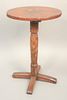 Oval Candlestand on turned shaft with X base, cherry, Connecticut circa 1740, height 24 1/2 inches, top 12 1/4" x 16 1/4". 
Literature: Connecticut Fu