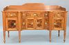Sheraton Sideboard having gallery back on shaped top over one long center drawer flanked by two small drawers flanked by two drawers...