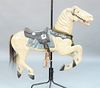 Diminutive Carousel Horse in old paint, collar mounted with jeweled glass.
height 38 inches, length 46 inches.
Provenance: From the ...