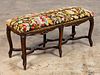 LOUIS XV CARVED BENCH, NEEDLEPOINT UPHOLSTERY