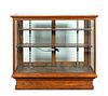 E. 20TH C. OAK AND GLASS STORE DISPLAY CASE