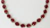 AIG Certified 64.16 Carat Oval Mixed Cut Natural Rubies, 5.81 Carats Round Brilliant Diamonds and 14 K Necklace.
