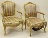 Assembled Pair of 19/20th Century Italian Carved, Painted and Parcel Gilt Wood Open Armchairs.