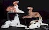 Five ceramic figures of reclining dogs, 20th c., longest - 12''.