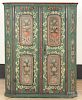 Scandinavian painted pine cupboard, early 19th c., retaining a later floral decorated surface, 58'' h.