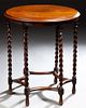 English Jacobean Style Carved Oak Lamp Table, early 20th c., the stepped circular top over a narrow skirt, on six slender rope twist...